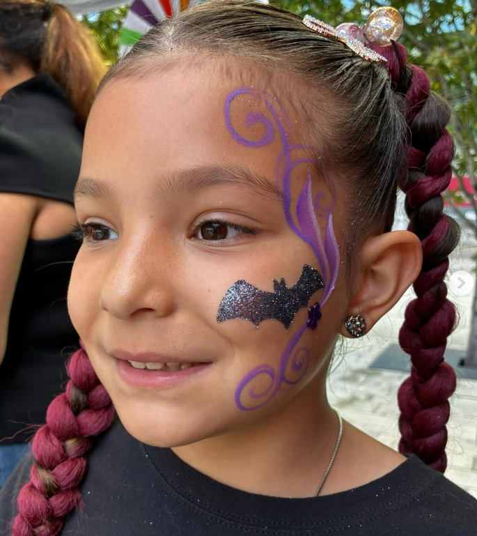 Glitter bat cheek design with swirls